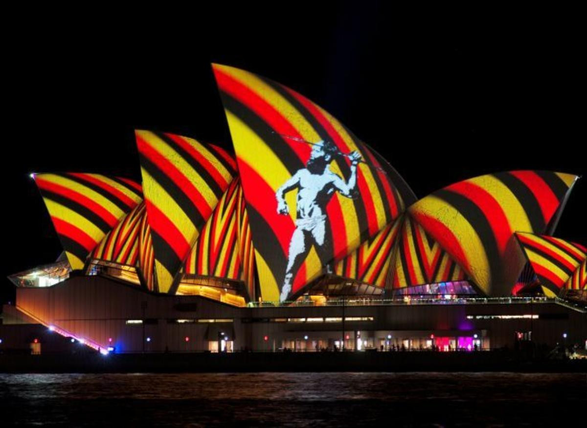 An image of an indigenous Australian man is projected onto the sails of the Sydney Opera House during the opening night of the annual Vivid Sydney light festival in Sydney, Australia, May 27, 2016. REUTERS/Jason Reed TPX IMAGES OF THE DAY - RTX2EG7V