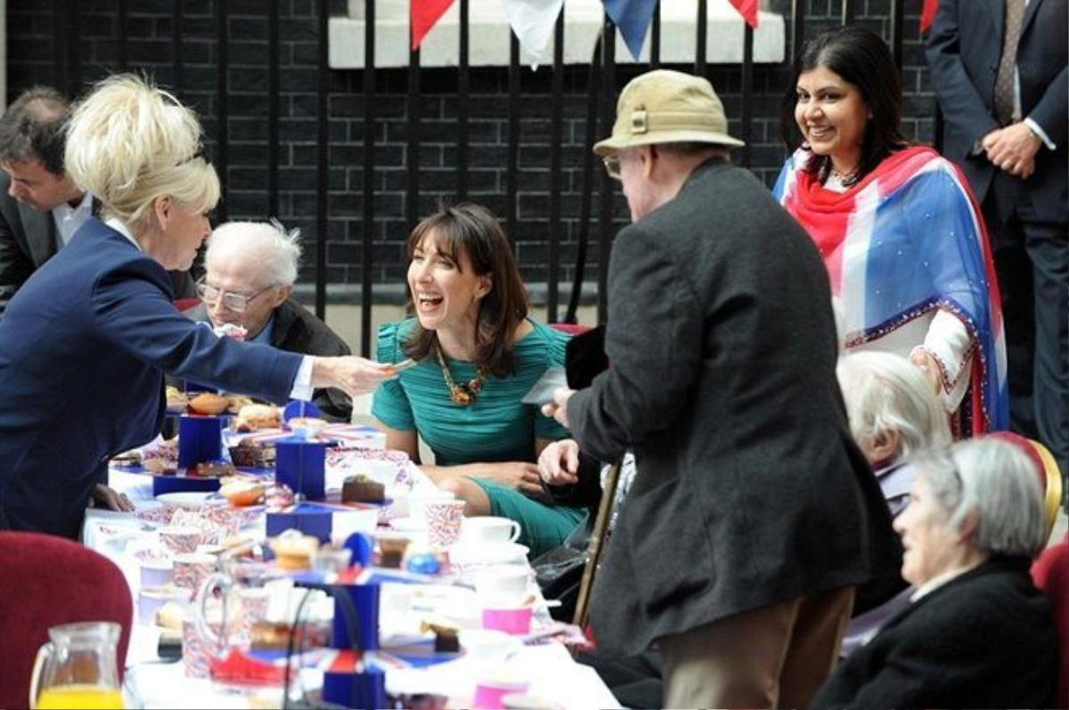 Prime Minister David Cameron's wife Sam shares a joke with Barbara Windsor at a street party in Downing Street after the wedding of Prince William and Kate Middleton. Picture by Damien McFadden: 07968 308252