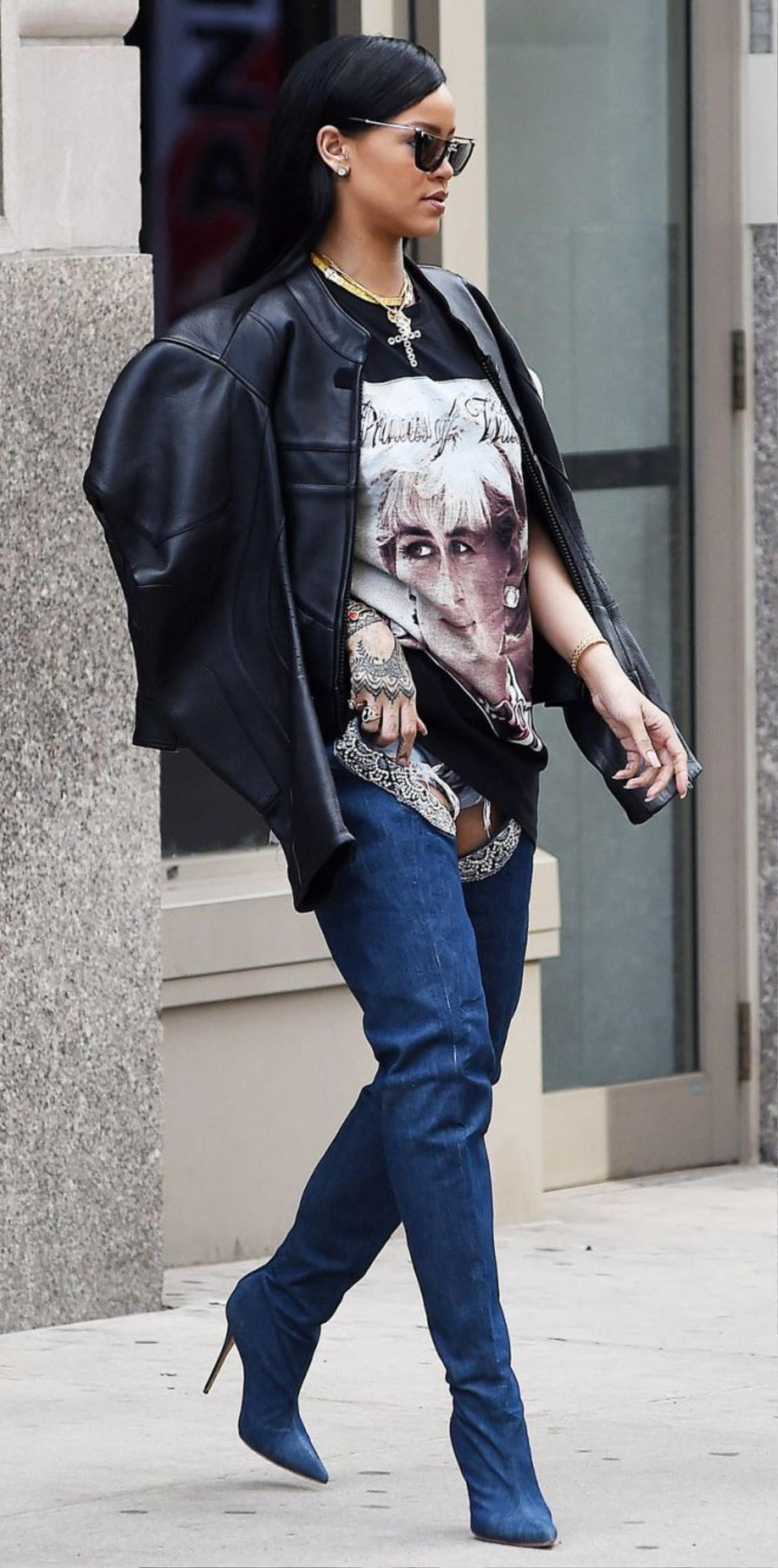 NEW YORK - APRIL 02: Rihanna seen leaving her Soho apartment in a Princess Diana print tee and blue jean boots on April 02, 2016 in New York, New York. (Photo by Josiah Kamau/BuzzFoto via Getty Images)