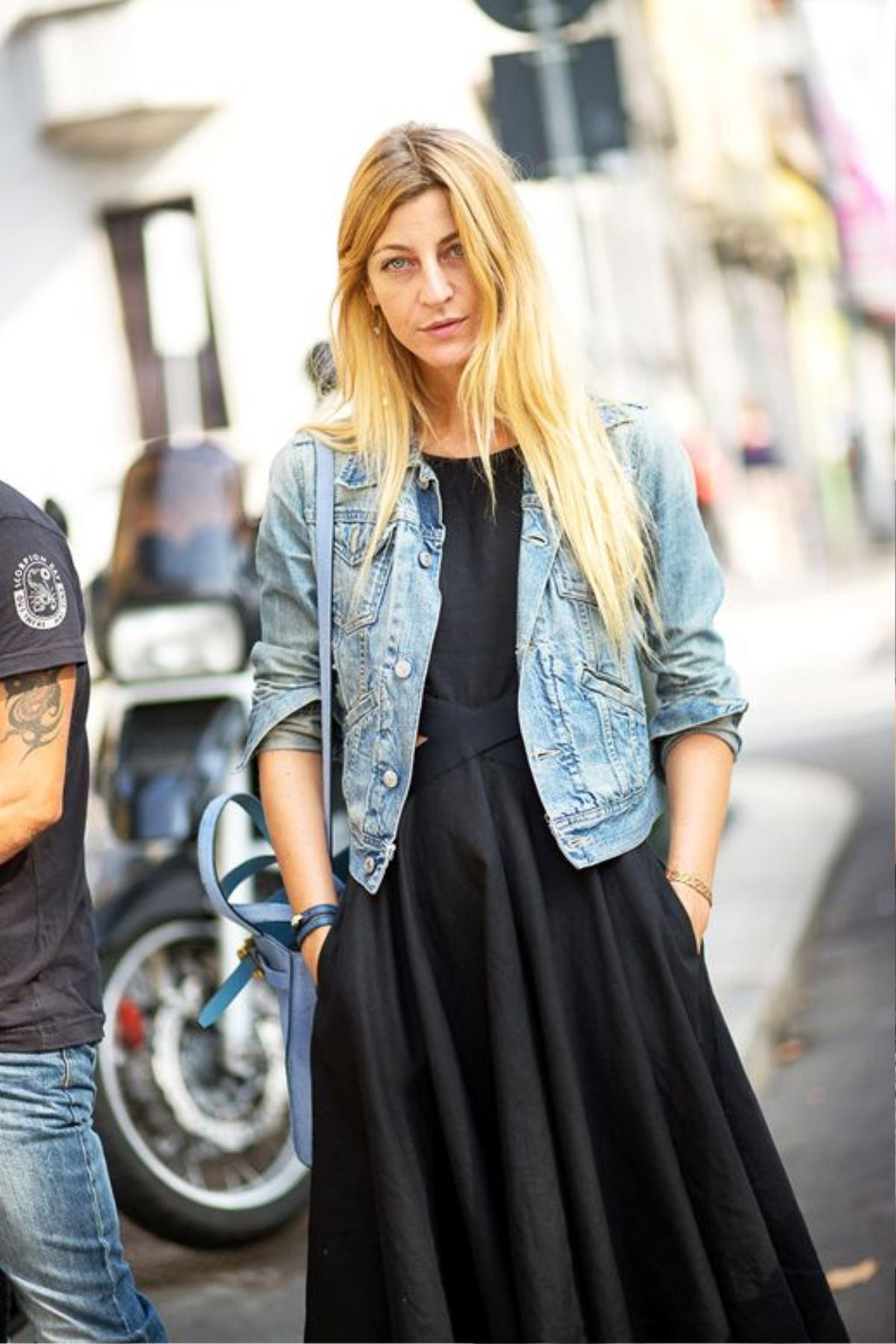 le-fashion-blog-summer-street-style-ada-kokosar-denim-jacket-pastel-blue-bag-long-black-cut-out-dress-with-pockets-via-harpers-bazaar