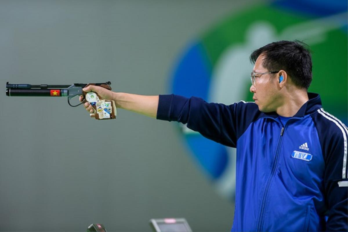 RIO DE JANEIRO - AUGUST 6: Gold medalist HOANG Xuan Vinh of Vietnam competes in the 10m Air Pistol Men Finals at the Olympic Shooting Center during Day 1 of the XXXI Olympic Games on August 6, 2016 in Rio de Janeiro, Brazil. (Photo by Nicolo Zangirolami)