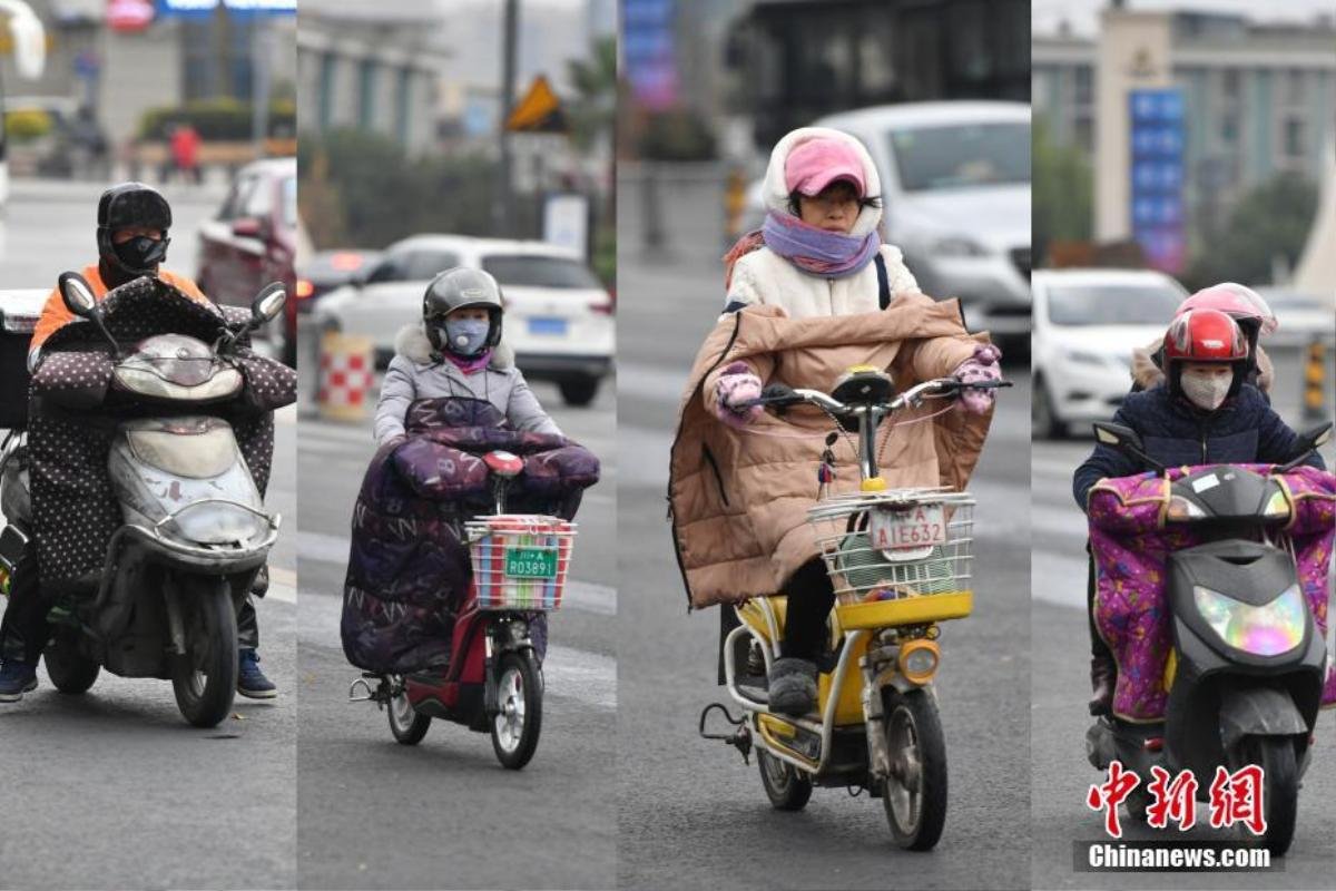 Trung Quốc lạnh âm độ trong trận Đại Tuyết, người dân quấn áo choàng dày như chăn ra đường Ảnh 11