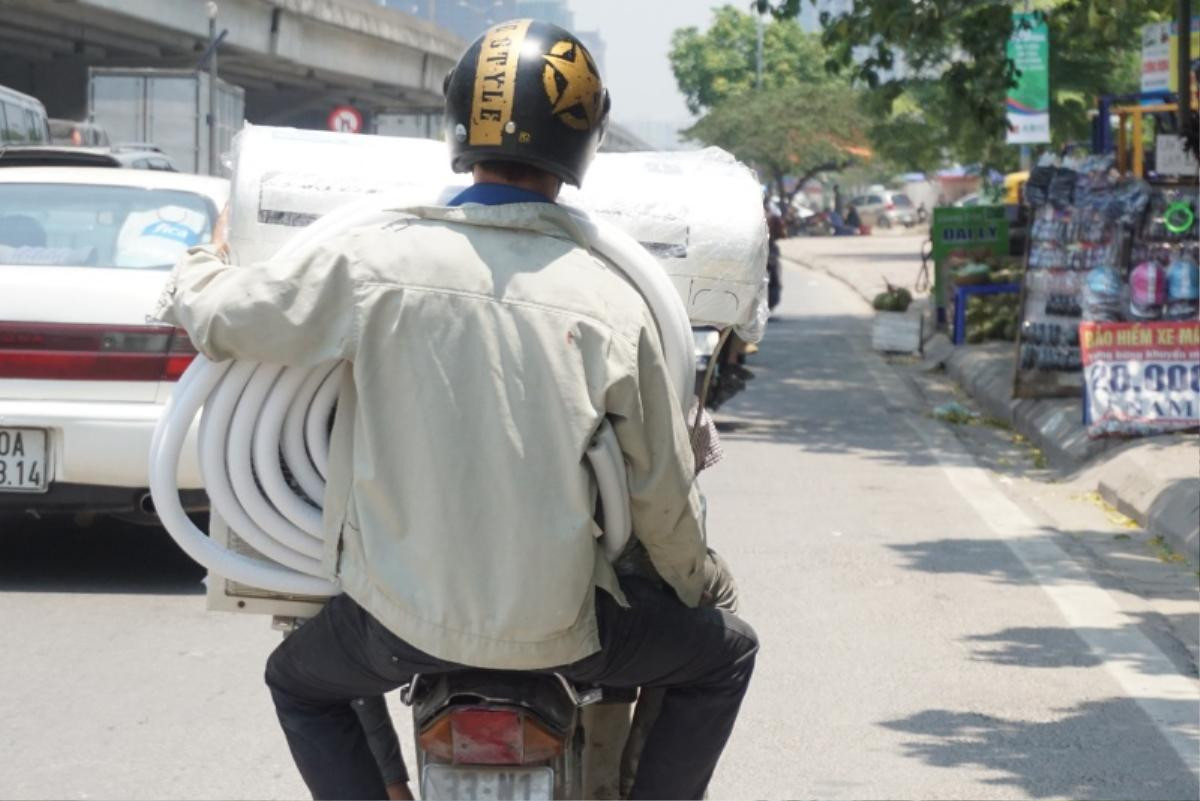 Thợ điều hoà ‘hốt bạc’, làm việc hết công suất vào mùa Hà Nội nắng nóng đỉnh điểm hơn 40 độ C Ảnh 7