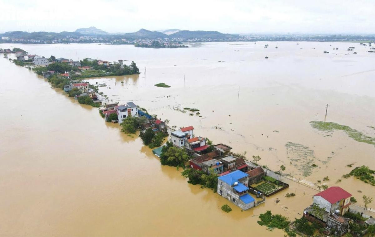 9.000 người dân Bắc Giang bị cô lập trong đêm khi sông Cầu dâng lũ lớn nhất trong 40 năm Ảnh 1