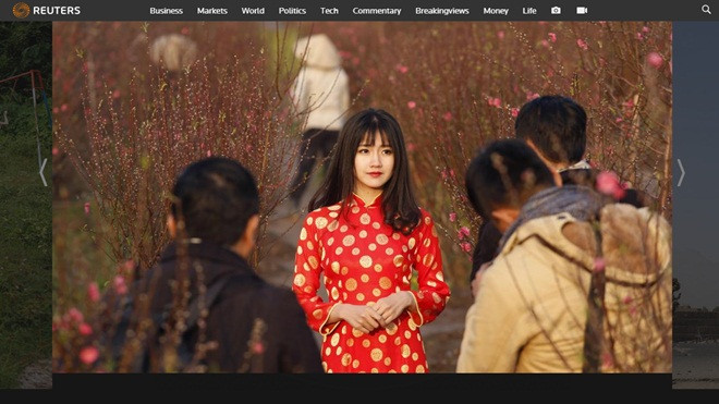'Cô gái Việt đứng giữa vườn đào' trong bộ ảnh của hãng thông tấn Reuters danh tiếng là ai? Ảnh 2