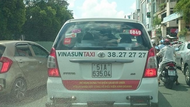 Việc Vinasun dán băng rôn trên taxi có thể bị xử lý về tội gây rối trật tự Ảnh 2