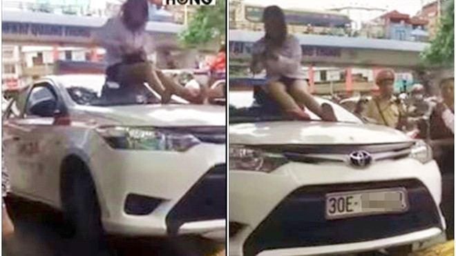 Bị CSGT dừng xe vì vượt đèn đỏ, nữ tài xế chửi bới rồi trèo lên nóc ôtô ăn vạ Ảnh 2