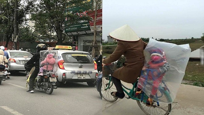 Khóe mắt cay cay nhìn cảnh bố mẹ bọc nilon quanh người giữ ấm cho con ngày giá rét Ảnh 2