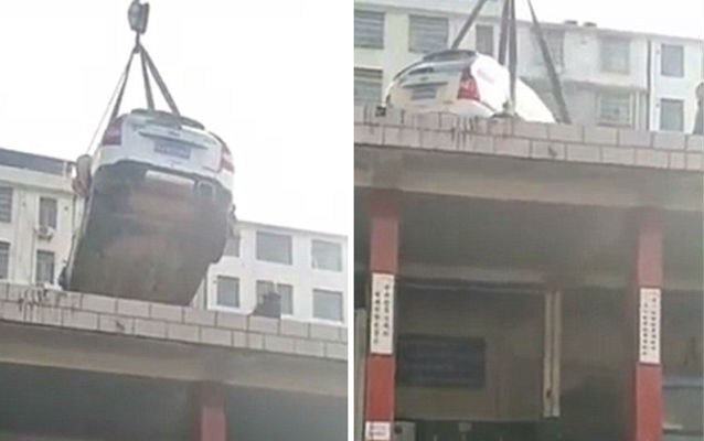 Hình phạt 'khó đỡ': Cẩu xe đỗ sai vị trí lên nóc nhà Ảnh 2