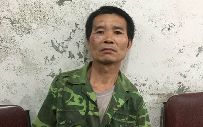 Bắt kẻ trốn nã trốn trong rừng sâu, nuôi chó và dùng súng chống cự công an Ảnh 2