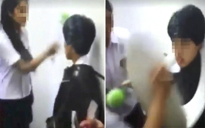 4 nữ sinh dùng bàn chải bồn cầu đánh vào mặt bạn trong nhà vệ sinh Ảnh 2