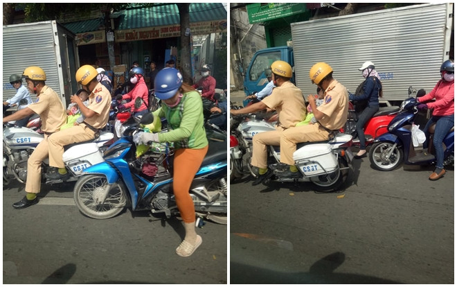 Ấm lòng trước hình ảnh CSGT bế cháu bé đi cấp cứu giúp người mẹ đang mắc kẹt giữa dòng xe cộ đông đúc Ảnh 2