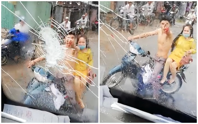 Nam thanh niên chở bạn gái đuổi theo ném vỡ kính xe vì bị ô tô bắn nước bẩn lên người khi đi đám cưới Ảnh 2