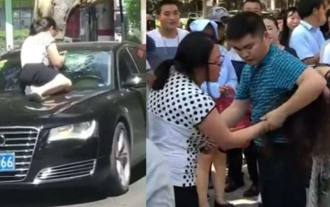 Thấy chồng và nhân tình trong ô tô, người vợ nhảy lên mui xe đánh ghen Ảnh 2