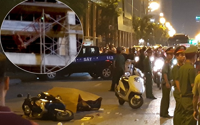 Thanh sắt giàn giáo rơi xuống đường Lê Văn Lương khiến cô gái trẻ tử vong: Hiện trường đầy thương tâm Ảnh 2