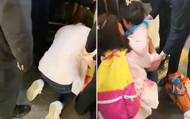 Mẹ cắm mặt vào điện thoại, con ngã xuống đường ray tàu mà không biết Ảnh 2