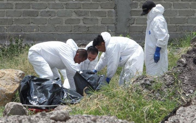 Phát hiện ít nhất 44 thi thể bị cắt nhỏ thối rữa chôn dưới giếng Ảnh 2