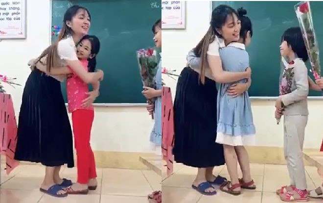Hình ảnh cô giáo lần lượt ôm từng học trò gây ấn tượng mạnh với cộng đồng mạng, đáng nói hơn nữa phải kể đến vẻ đẹp dịu dàng của cô giáo Ảnh 2