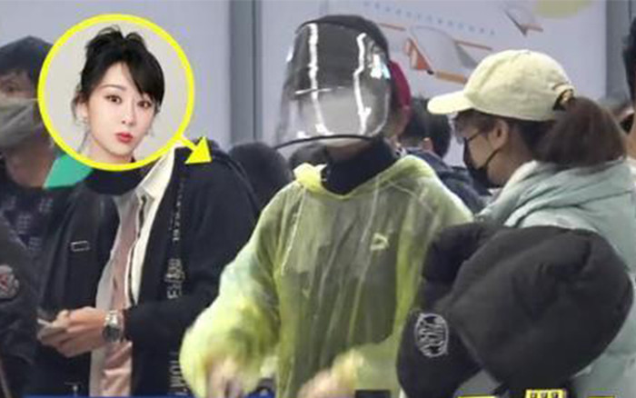 Cách phòng dịch 'bá đạo'của Dương Tử: Mặc áo mưa, đội mũ bảo hộ che kín mặt Ảnh 2