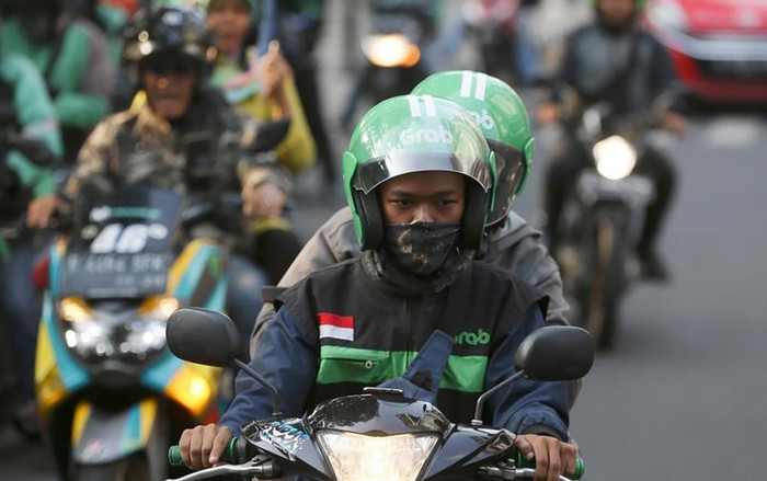 Nhà đầu tư giục Go-Jek và Grab sáp nhập khi cuộc đua đốt tiền đến hồi ‘khô máu’ Ảnh 2