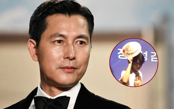 Jung Woo Sung đội nón lá, cúi chào fan Việt khi đi quảng bá phim Ảnh 2