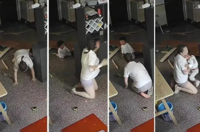 Mẹ quỳ sụp đau đớn ôm con sau vụ nổ gas kinh hoàng ở Chiết Giang khiến người xem xúc động.