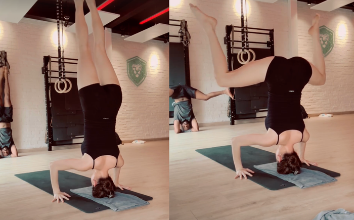 Hồ Ngọc Hà thực hiện động tác 'trồng chuối' trong thời gian dài, khoe khéo sự dẻo dai của cơ thể.