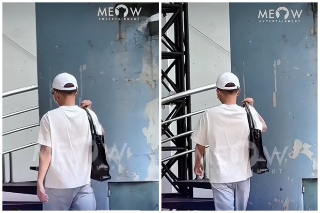 Minh Dự đội mũ, đeo khẩu trang kín mít khi lộ diện giữa ồn ào. (Ảnh Meow Entertainment)