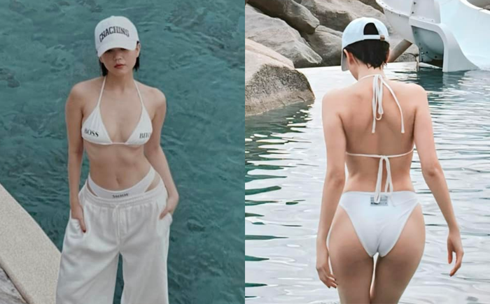 Ngọc Trinh sử dụng mẫu bikini nhỏ xíu màu trắng phối thành 2 outfit khoe khéo thân hình nóng bỏng.