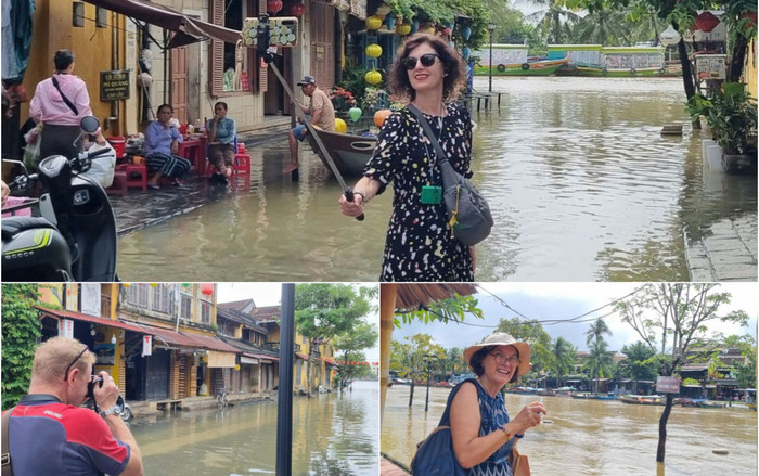 Khách Tây thích thú lội nước lụt chụp hình ở Hội An Ảnh 2