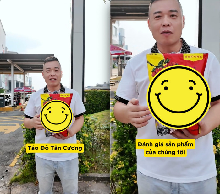 Tôn Bằng quay clip cho người đi đường ăn thử táo đỏ. Ảnh: Báo Phụ nữ thủ đô