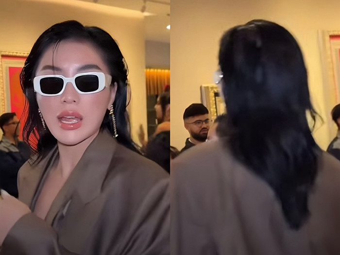 Hoa hậu Kỳ Duyên né câu hỏi từ truyền thông quốc tế, ra hiệu bày tỏ mong muốn được đi vào trong.