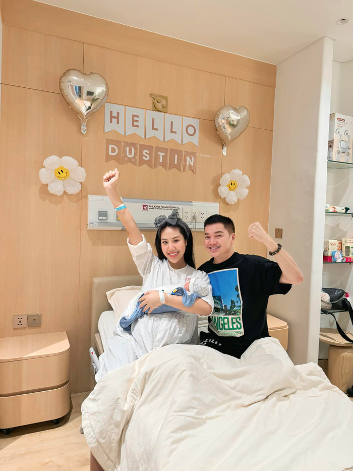 Hình ảnh nghệ sĩ Quang Minh bên cạnh bạn gái mới và con trai đầu lòng. Ảnh: FBNV