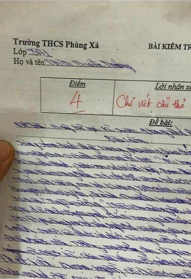 Bài kiểm tra được 4 điểm kèm lời phê: 'Chữ viết cẩu thả'