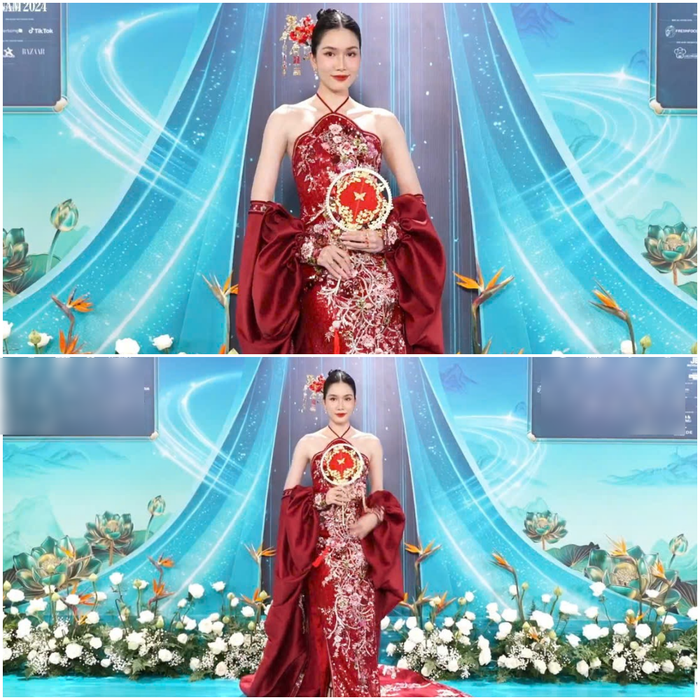 Á hậu Phương Anh tỏa sáng với vẻ đẹp đậm chất truyền thống trong tà áo dài cách tân sắc đỏ. Những họa tiết thêu tay tinh xảo cùng các chi tiết ánh kim trên nền vải satin tạo nên vẻ đẹp quý phái và kiêu sa. Điểm nhấn là phần tay áo choàng mềm mại, làm tăng thêm nét duyên dáng cho bộ trang phục. Với mái tóc búi cao gọn gàng cùng lối trang điểm sắc sảo, Phương Anh càng thêm nổi bật, khẳng định phong cách thời trang thanh lịch nhưng không kém phần hiện đại.