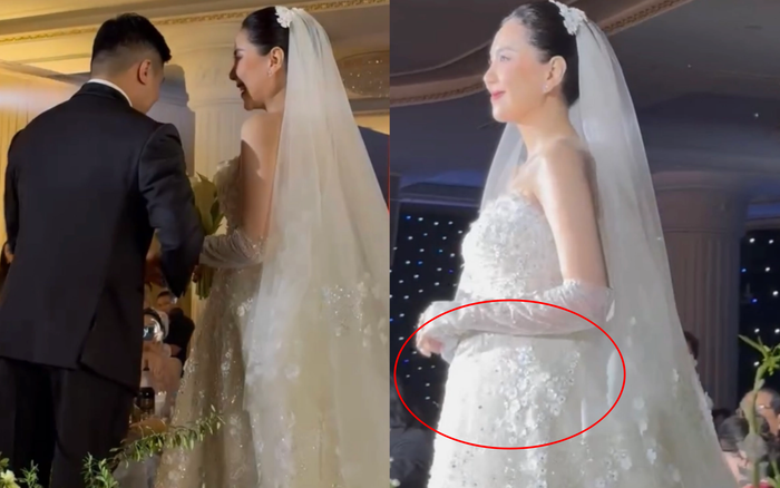 Trong đám cưới, MC Mai Ngọc cũng để lộ nhiều dấu hiệu đã lên chức 'mẹ bầu' ở tuổi 35. (Ảnh: Tiền Phong) 
