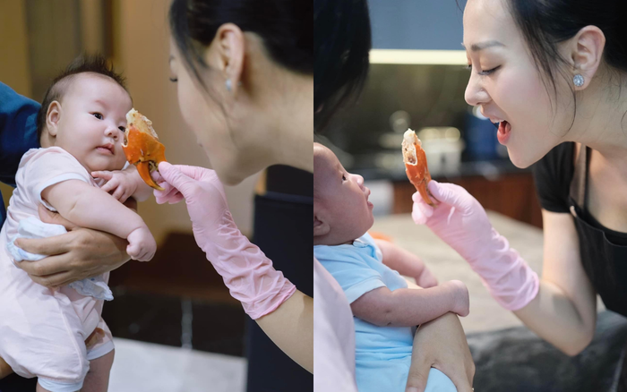 Phương Oanh vui vẻ trêu đùa con trong lúc nấu ăn. Ảnh: FBNV