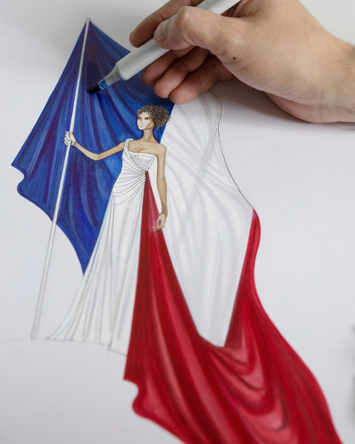 Hình ảnh chiếc váy màu cờ nước Pháp được phác họa trên giấy. 