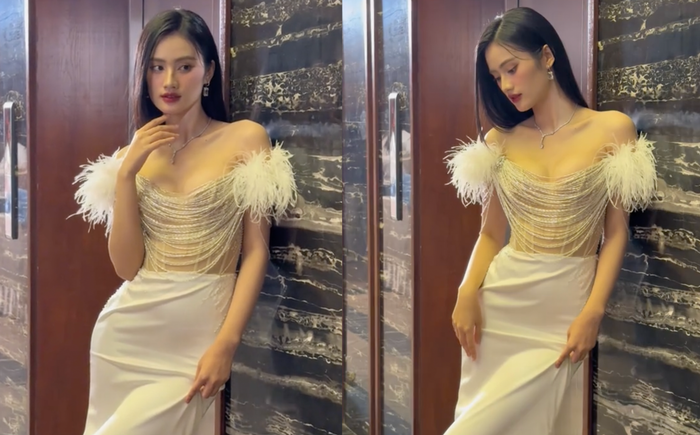 Hoa hậu Ý Nhi diện mốt váy trễ nải, để lộ đôi 'gò bồng đảo' nóng bỏng. (Ảnh chụp màn hình)