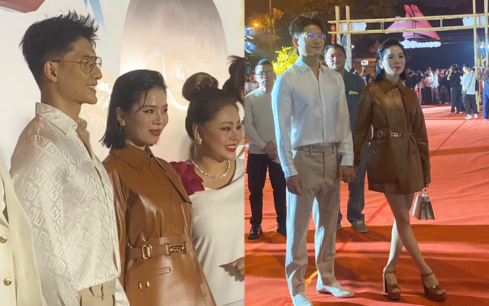 Cặp đôi nắm chặt tay nhau trêm thảm đỏ sự kiện công chiếu Bộ Tứ Báo Thủ.