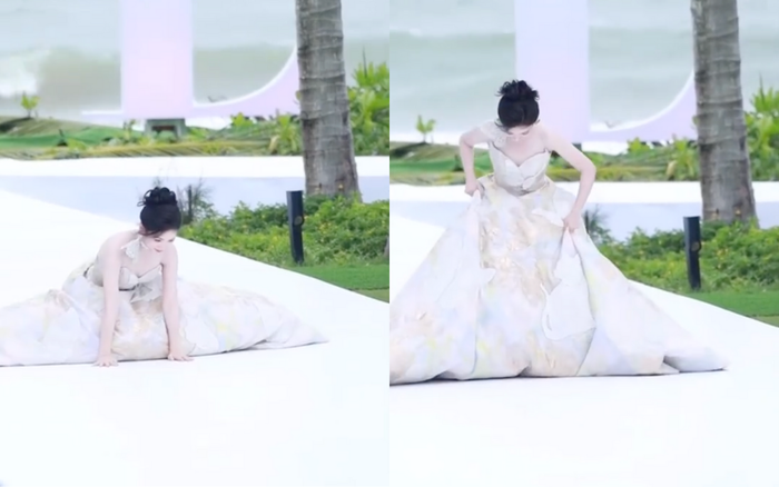 Đại Lộ Oa cố gắng đứng dậy, tự kéo váy để tiếp tục màn trình diễn còn dang dở. Ảnh chụp màn hình