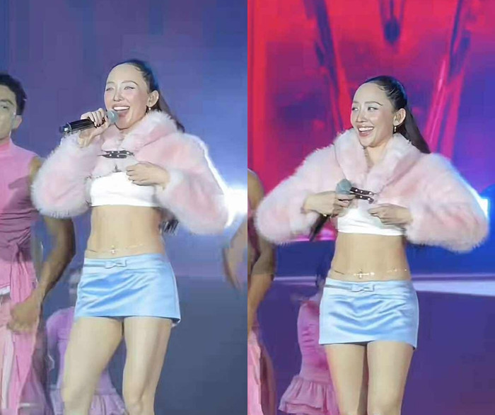 Sau màn vũ đạo bưng bê, nữ ca sĩ tranh thủ chỉnh lại trang phục vì sợ lộ khoảnh khắc hớ hênh trước khán giả. (Ảnh từ TikTok vietdaily)