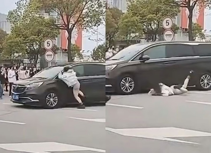 Phẫn nộ nữ khán giả đu theo xe ca sĩ, ngã ra đường đầy nguy hiểm Ảnh 1