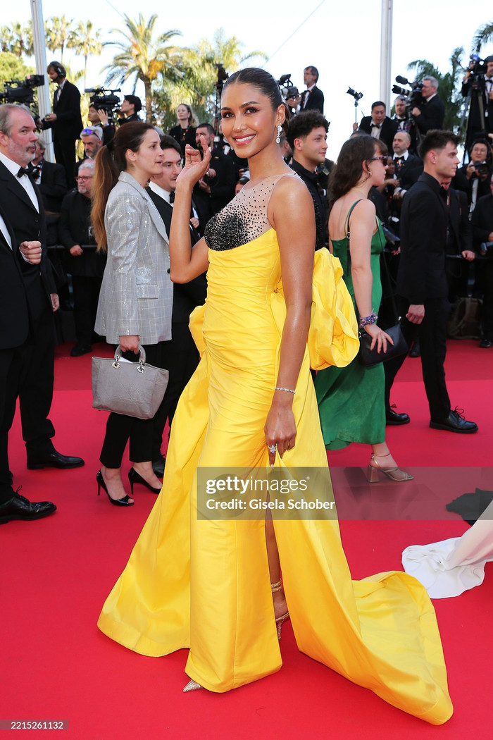 Praewwanich Ruangthong - Á hậu 1 Miss Supranational 2022 thay đổi 'chiến lược' váy áo khi xuất hiện trên thảm đỏ Liên hoan phim Cannes 2025 ngày thứ 3. Khác với ngày thứ 2, mỹ nhân người Thái 'chặt chém' với mẫu váy dạ hội màu vàng chanh bắt mắt. Phần họa tiết nơ kích cỡ lớn đính phía sau lưng còn phần nào giúp tạo hình của Praewwanich Ruangthong thêm phần ấn tượng. (Ảnh: Getty Images)