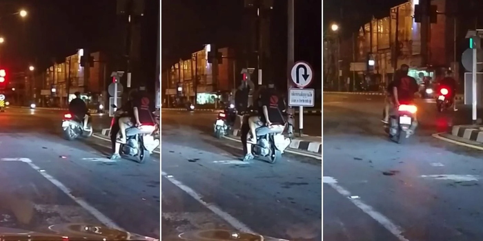 Người đàn ông đi xe máy tự điều chỉnh đèn giao thông tại ngã tư Ảnh 2