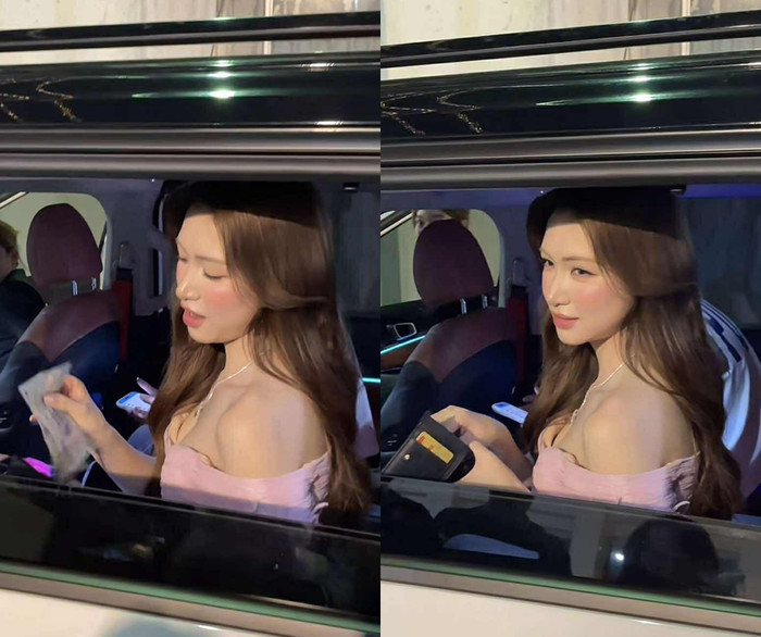 Hòa Minzy rút ví lấy tiền để tặng fan. (Ảnh chụp màn hình từ TikTok Trong12.hmz)