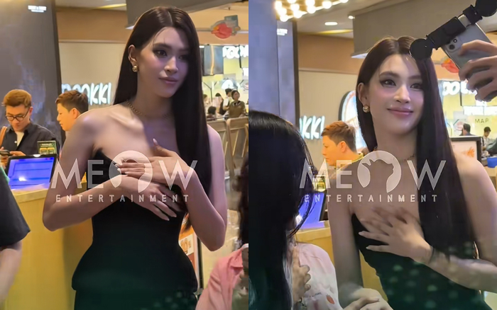 Tiểu Vy lấy tay che chắn khi chụp ảnh cùng khán giả trong một sự kiện mới nhất. Ảnh: meowentertainment