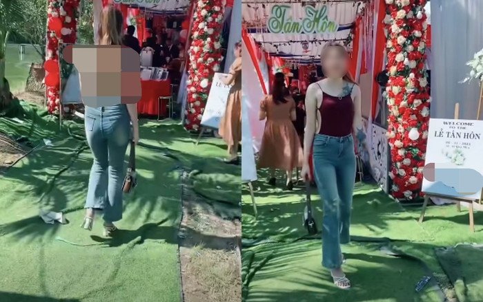 Cô gái mặc chiếc áo hở toàn bộ phần lưng đến đám cưới đã khiến dân mạng bàn tán dữ dội. Ảnh cắt từ clip