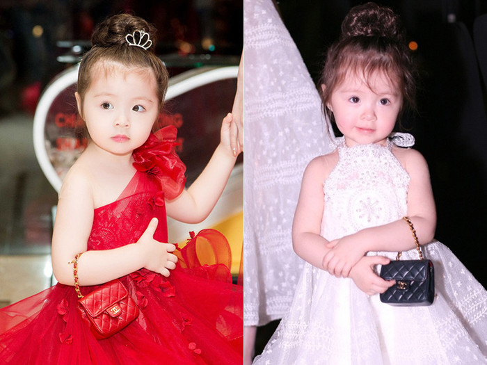 Cadie Mộc Trà - con gái của Elly Trần dùng hai chiếc túi mini đắt đỏ để mix cùng váy bồng công chúa. Cách đeo túi ngay tay cũng vô cùng 'điệu', như một fashionista nhí. 