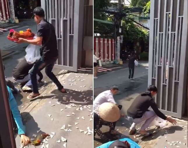 Nam thanh niên bê nguyên đĩa heo quay chạy thẳng vào ngõ.